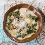 Zuppa Toscana Soup served in a brown bowl.