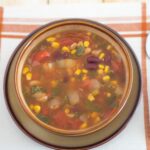 Vegetarian Bean Soup in a brown soup bowl.