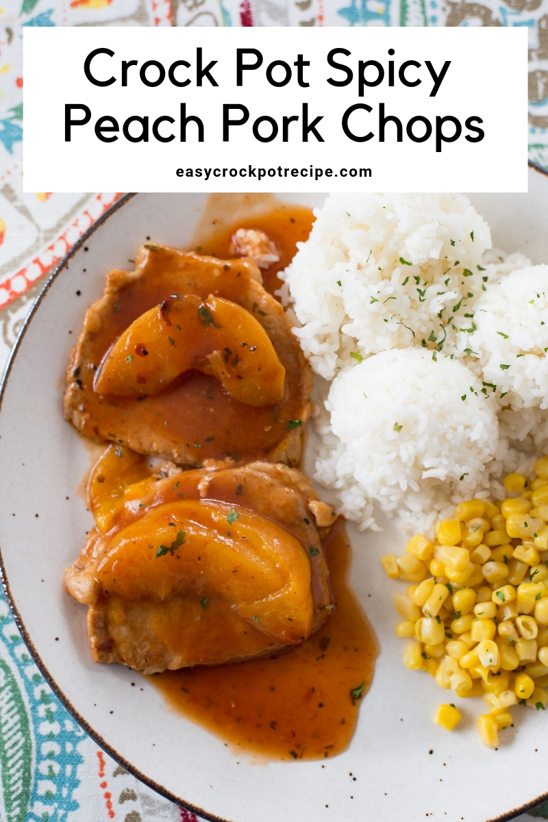 Crock Pork Spicy Peach Pork Chops on a plate with white rice and corn