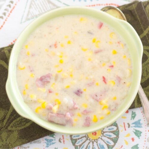 Crock Pot Corn and Ham Chowder in a green soup bowl.