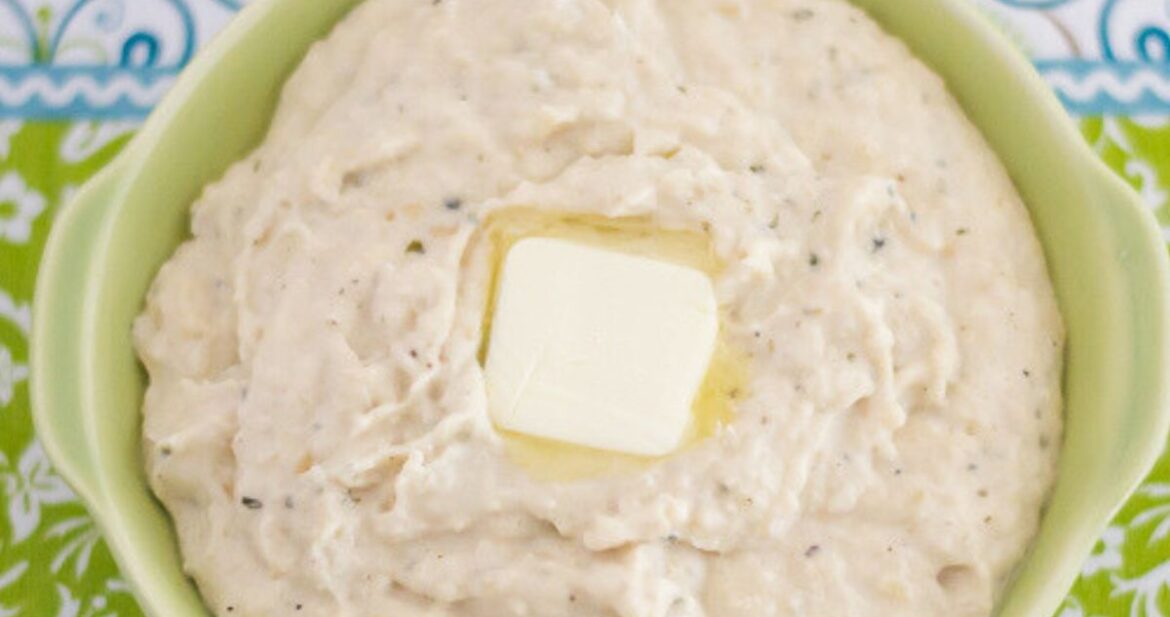 A serving bowl with Ranch Mashed Cauliflower on a table.