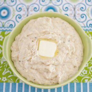 A serving bowl with Ranch Mashed Cauliflower on a table.