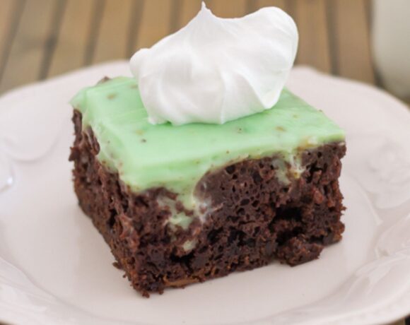 Square piece of Pistachio Poke Cake on a plate.