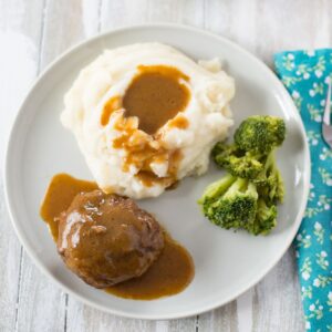 Salisbury Steak served with mashed potatoes and gravy.